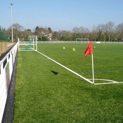 Sports drainage channel installed within a sports field