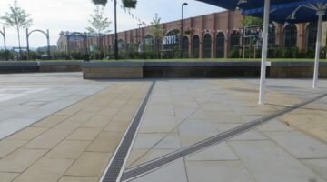 RECYFIX STANDARD installed within paved terrazzo areas