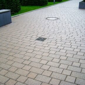 Point drainage systems installed in paved surface