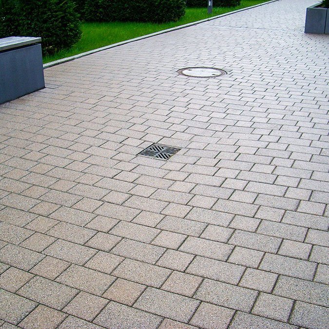 Point drainage systems installed in paved surface